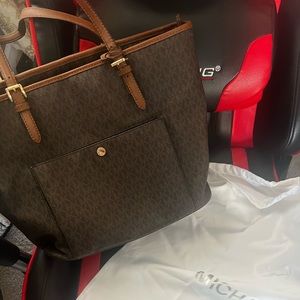 Michael Kors handbag with protective duster back Still has tags barely used